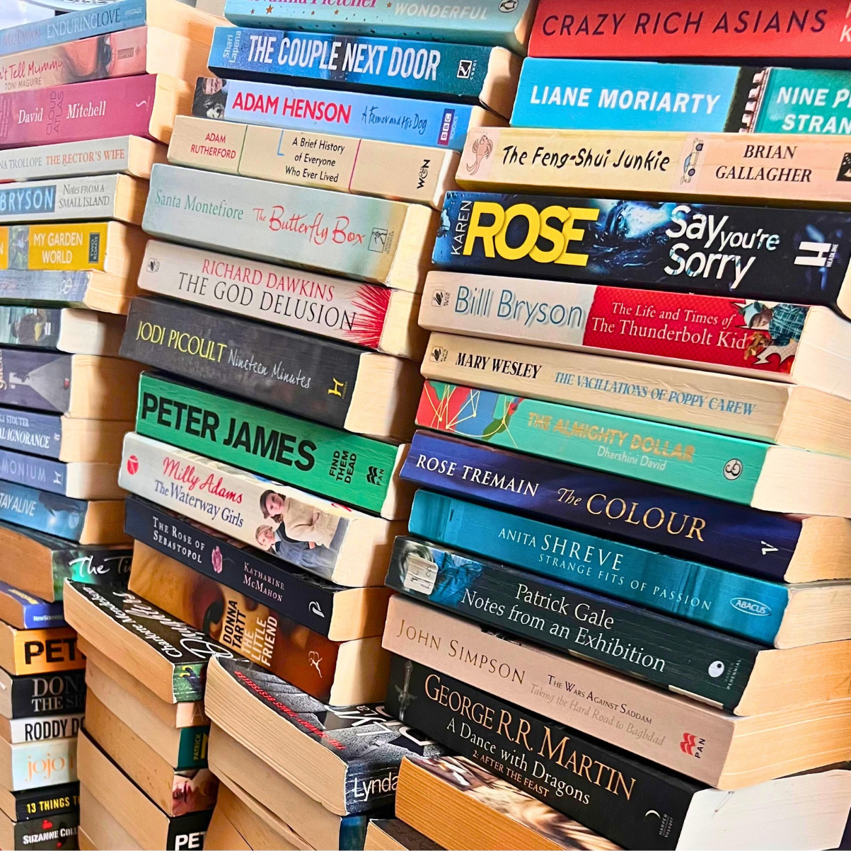 A pile of paperback books waiting to be sorted