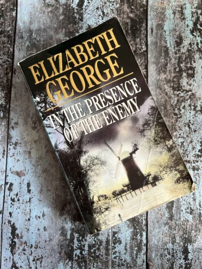 An image of a book by Elizabeth George - In the Presence of the Enemy