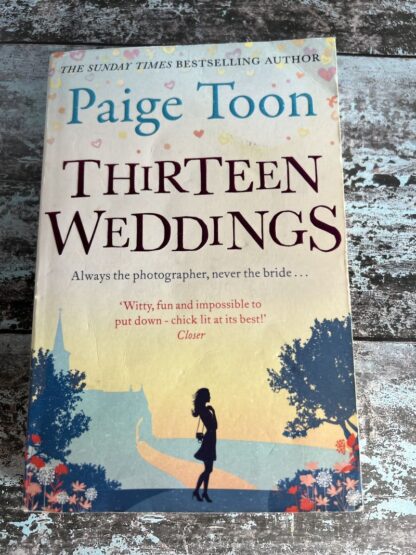 An image of a book by Paige Toon - Thirteen Weddings