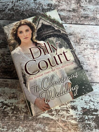 An image of a book by Dilly Court - The Christmas Wedding