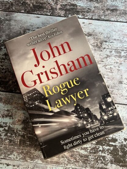 An image of a book by John Grisham - Rogue Lawyer