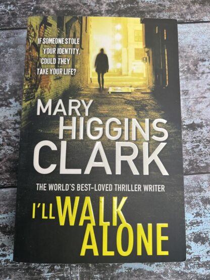 An image of a book by Mary Higgins Clark - I'll Walk Alone