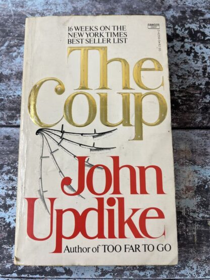 An image of a book by John Updike - The Coup