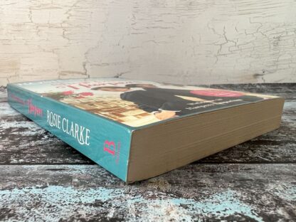 An image of a book by Rosie Clarke - The Shop Girls of Harpers