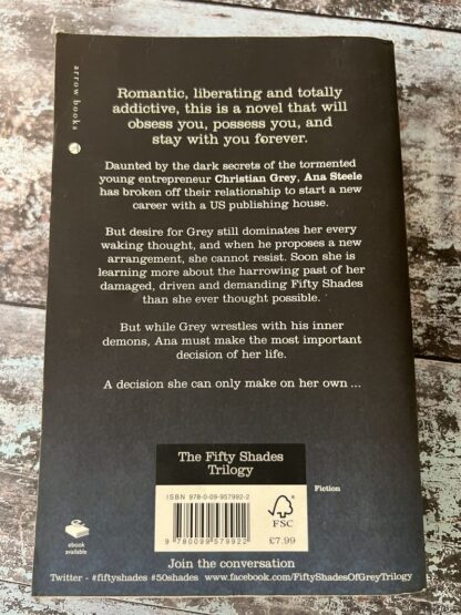 An image of a book by E L James - Fifty Shades Darker