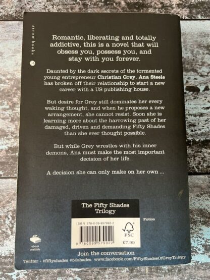 An image of a book by E L James - Fifty Shades Darker