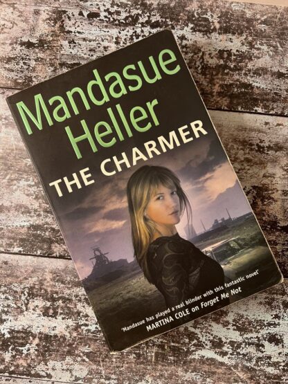 An image of a book by Mandasue Heller - The Charmer
