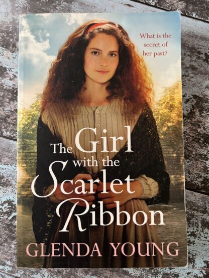 An image of a book by Glenda Young - The Girl with the Scarlet Ribbon