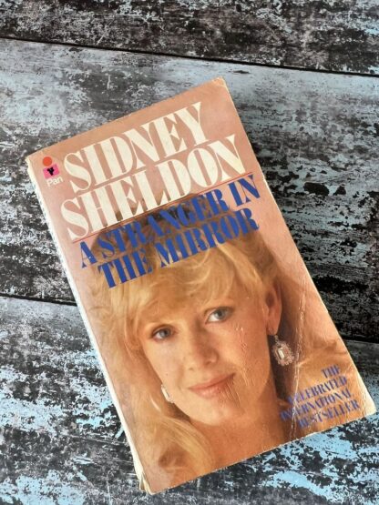 An image of a book by Sidney Sheldon - A Stranger in the Mirror