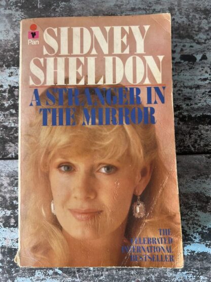An image of a book by Sidney Sheldon - A Stranger in the Mirror