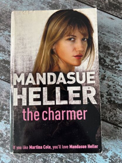 An image of a book by Mandasue Heller - The Charmer