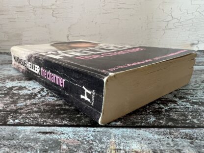 An image of a book by Mandasue Heller - The Charmer