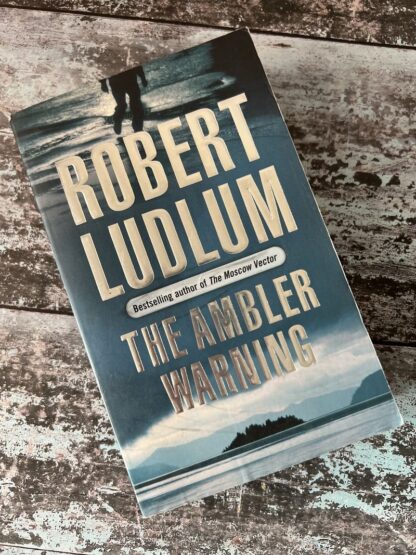 An image of a book by Robert Ludlum - The Ambler Warning