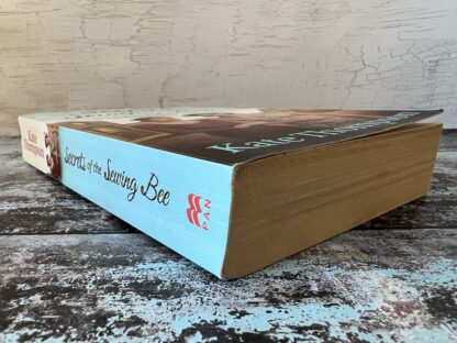 An image of a book by Kate Thompson - Secrets of the Sewing Bee