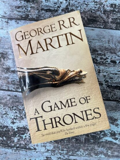 An image of a book by George R R Martin - A Game of Thrones