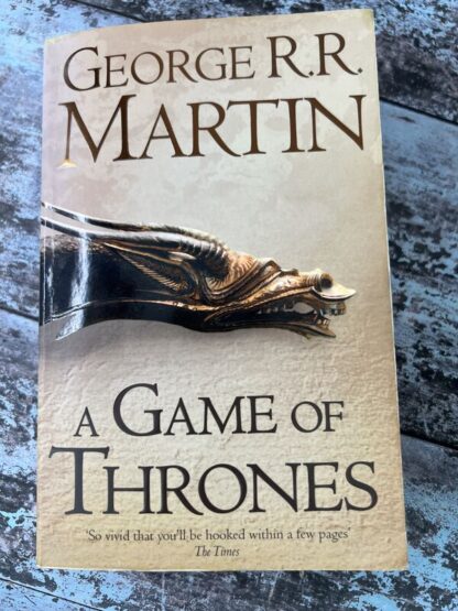 An image of a book by George R R Martin - A Game of Thrones