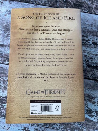 An image of a book by George R R Martin - A Game of Thrones