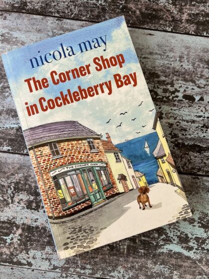 An image of a book by Nicola May - The corner shop in cockleberry bay