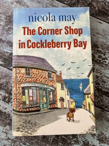 An image of a book by Nicola May - The corner shop in cockleberry bay