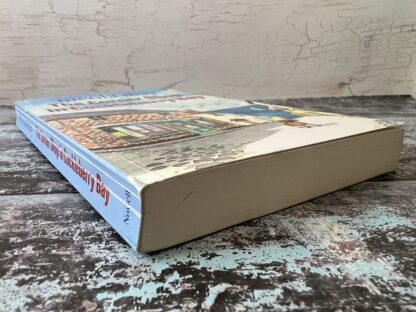 An image of a book by Nicola May - The corner shop in cockleberry bay