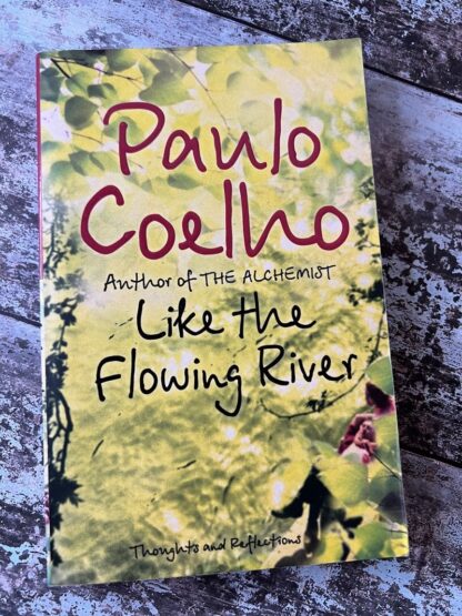 An image of a book by Paulo Coelho - Like the flowing river