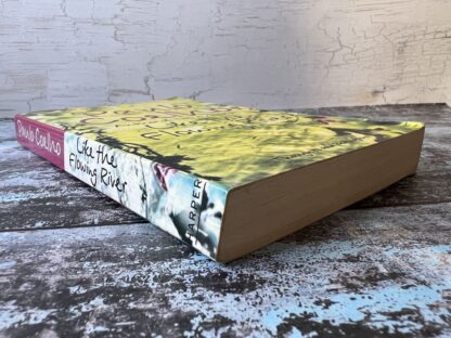 An image of a book by Paulo Coelho - Like the flowing river