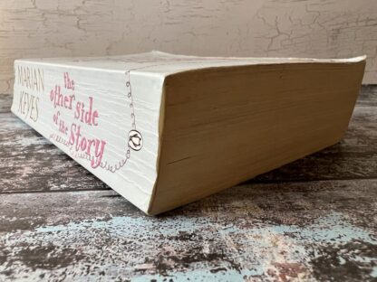 An image of a book by Marian Keyes - The other side of the story