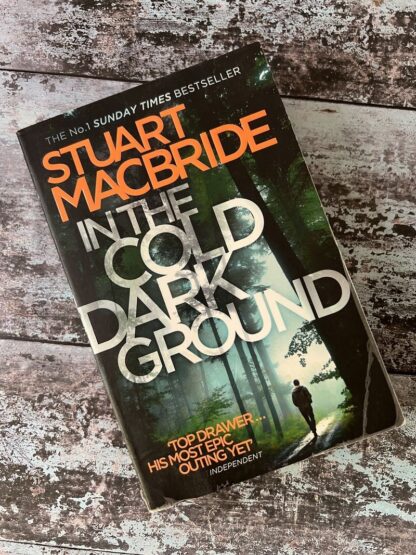 An image of a book by Stuart Macbride - In the cold dark ground