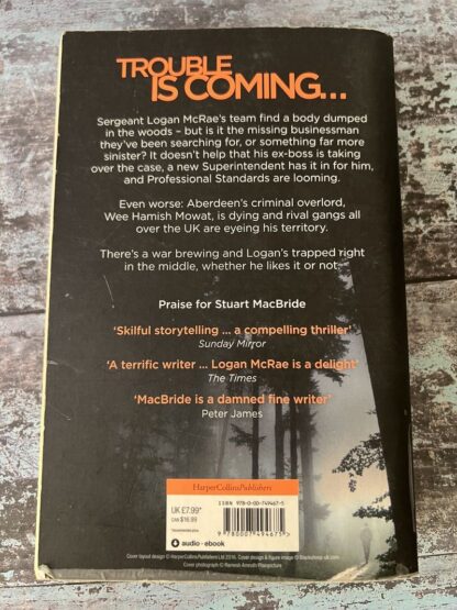 An image of a book by Stuart Macbride - In the cold dark ground