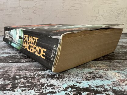 An image of a book by Stuart Macbride - In the cold dark ground