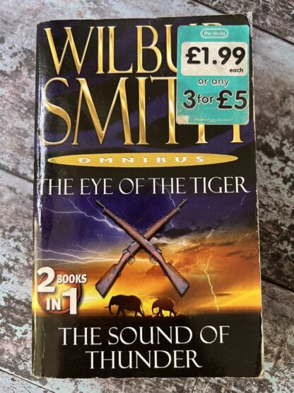An image of a book by Wilbur Smith - The eye of the tiger and the sound of thunder