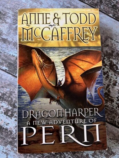 An image of a book by Anne and Todd McCaffrey - Dragon Harper