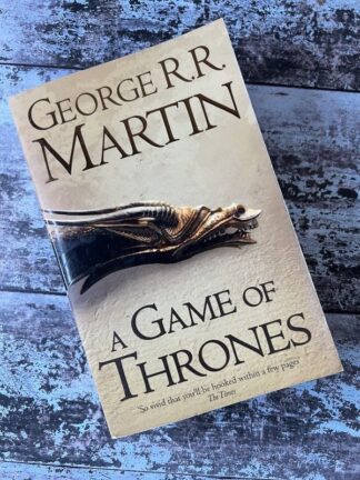 An image of a book by George R R Martin - A Game of Thrones