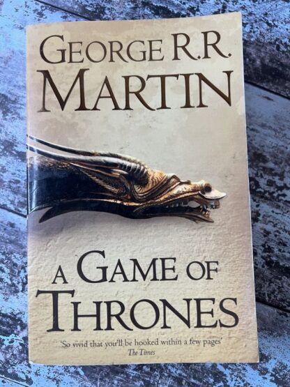 An image of a book by George R R Martin - A Game of Thrones