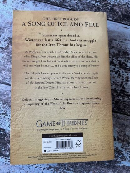 An image of a book by George R R Martin - A Game of Thrones