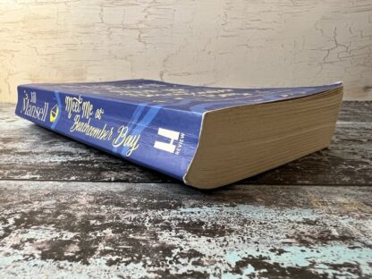 An image of a book by Jill Mansell - Meet Me at Beachcomber Bay