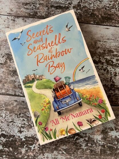 An image of a book by Ali McNamara - Secrets and Seashells at Rainbow Bay