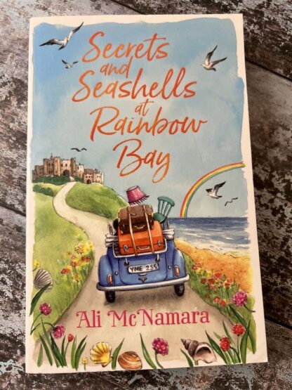 An image of a book by Ali McNamara - Secrets and Seashells at Rainbow Bay