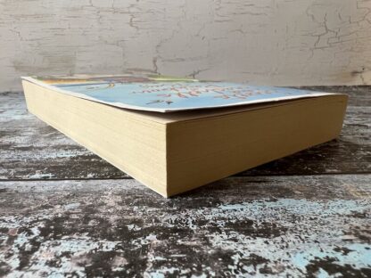 An image of a book by Ali McNamara - Secrets and Seashells at Rainbow Bay