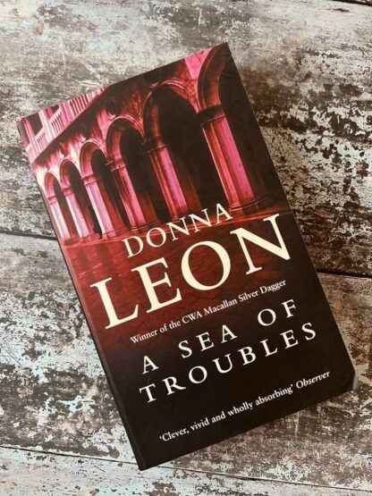 An image of a book by Donna Leon - A Sea of Troubles