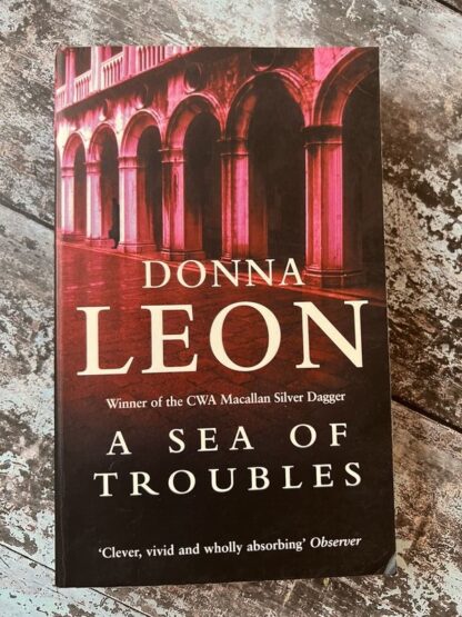 An image of a book by Donna Leon - A Sea of Troubles