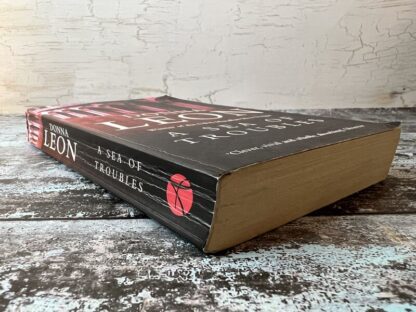 An image of a book by Donna Leon - A Sea of Troubles