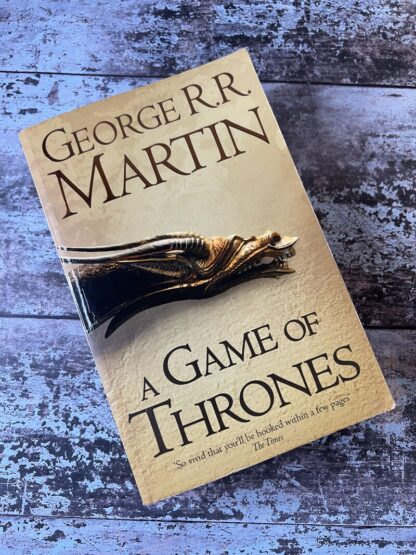 An image of a book by George R R Martin - A Game of Thrones