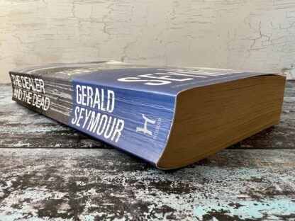 An image of a book by Gerald Seymour - The Dealer and the Dead