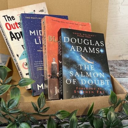 A cardboard box with four novels shown in front