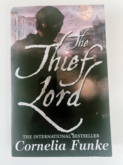 Affordable secondhand The Thief Lord by Cornelia Funke, paperback, very good condition, photo-verified, StrangeBooks UK