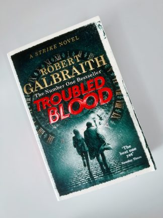 Affordable secondhand Troubled Blood by Robert Galbraith, paperback, very good condition, photo-verified, StrangeBooks UK