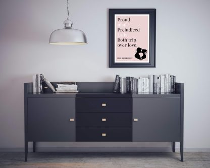 Humorous Pride and Prejudice print in black frame on wall, with black sideboard and books below. From Bookish Prints collection by StrangeBooks UK
