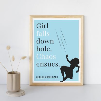 Humorous Alice in Wonderland print in wooden frame, leaning against a plain wall. Small beige decoration nearby. From Bookish Prints collection by StrangeBooks UK