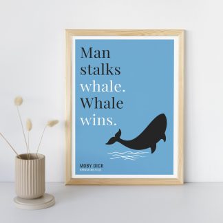 Humorous Moby Dick print in wooden frame, leaning against a plain wall. Small beige decoration nearby. From Bookish Prints collection by StrangeBooks UK